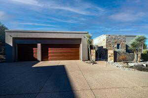 Garage featuring concrete driveway
