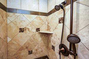 Bathroom view of a tile shower