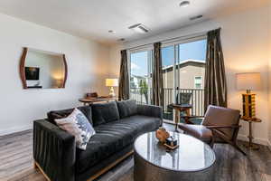 Living room featuring wood finished floors and a textured ceiling
