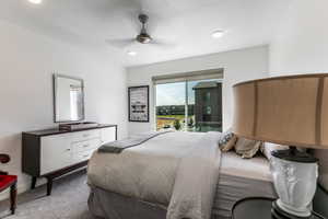 Bedroom featuring carpet, ceiling fan, a textured ceiling, and access to outside