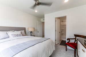 Bedroom featuring recessed lighting, ensuite bathroom, ceiling fan, and light carpet