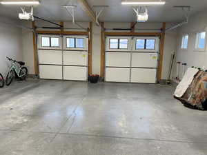 Garage featuring a garage door opener