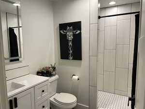 Bathroom featuring vanity and a shower stall