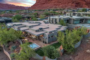 Aerial perspective of suburban area featuring a mountain backdrop