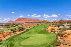 View of community with golf course view and a mountain view