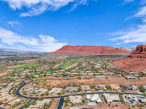 Aerial view of residential area featuring mountains