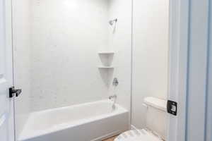 Full bath with bathtub / shower combination and toilet