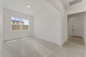 Spare room featuring carpet floors