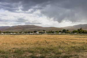 View of mountain backdrop featuring rural landscape