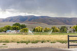 View of mountain background featuring rural landscape