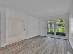 Unfurnished room featuring light wood finished floors and recessed lighting
