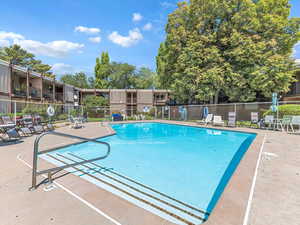 Community pool featuring a patio