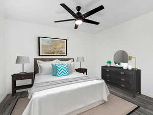 Bedroom featuring dark wood-style floors and ceiling fan