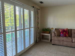 Living area featuring carpet floors