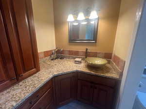 Bathroom featuring vanity and tile patterned floors