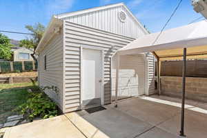 View of outbuilding with a garage