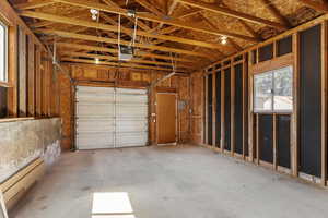 Garage featuring a garage door opener