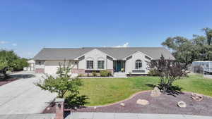 Ranch-style house with concrete driveway, brick siding, roof with shingles, and an attached garage