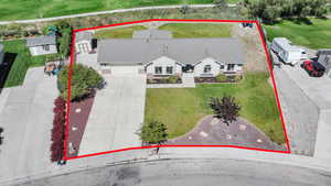 Aerial view of property and surrounding area with property parcel outlined