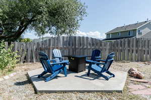 Fenced backyard with a patio