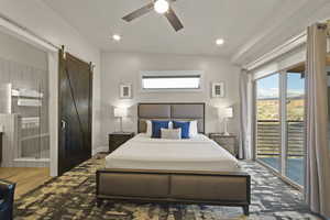 Bedroom with access to exterior, a barn door, a ceiling fan, recessed lighting, and ensuite bath