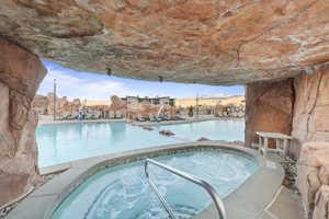 Community pool with a community hot tub and a patio area