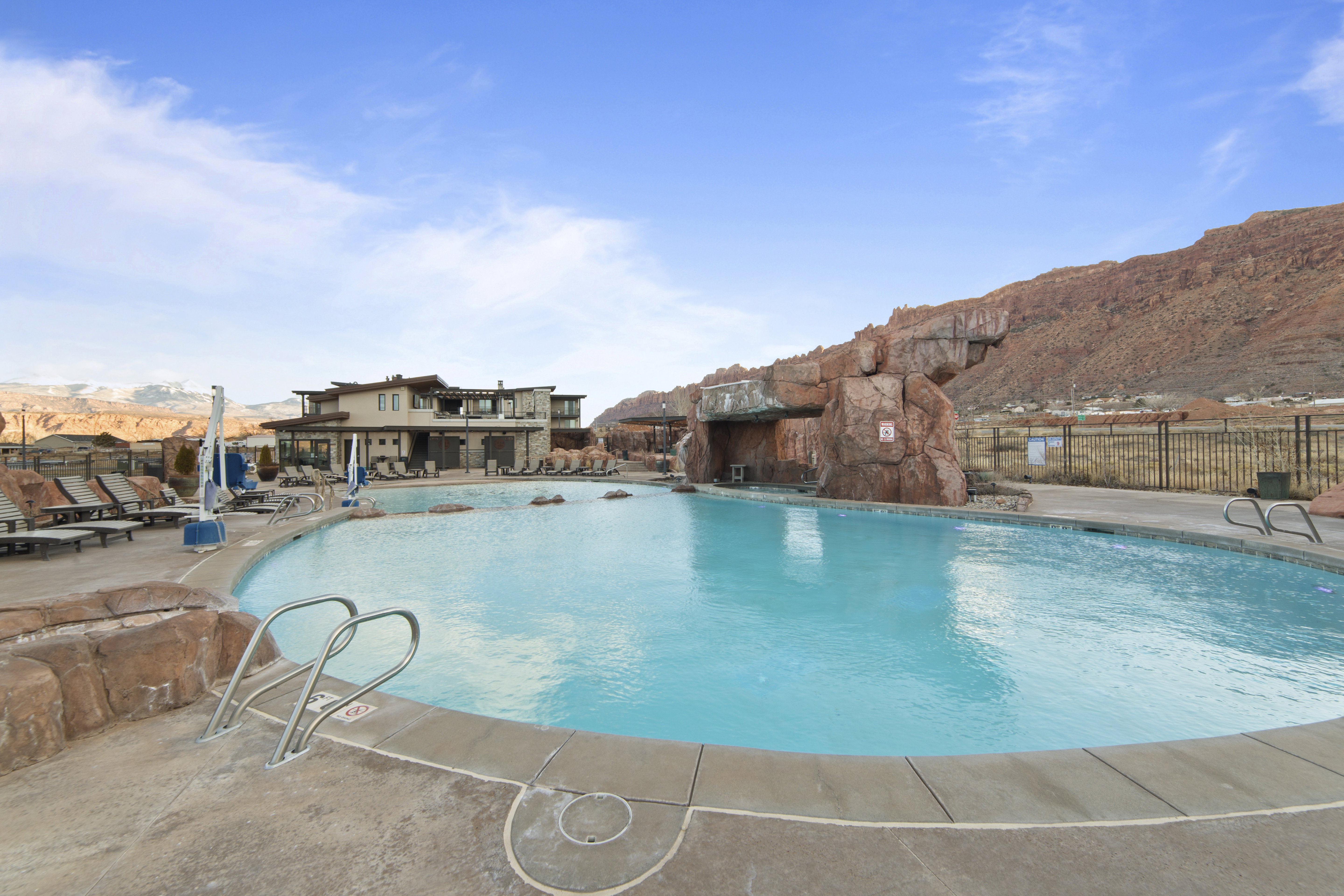 Community pool with a patio area