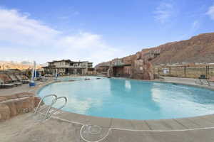 Community pool with a patio area
