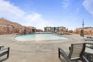 Community pool featuring a patio area