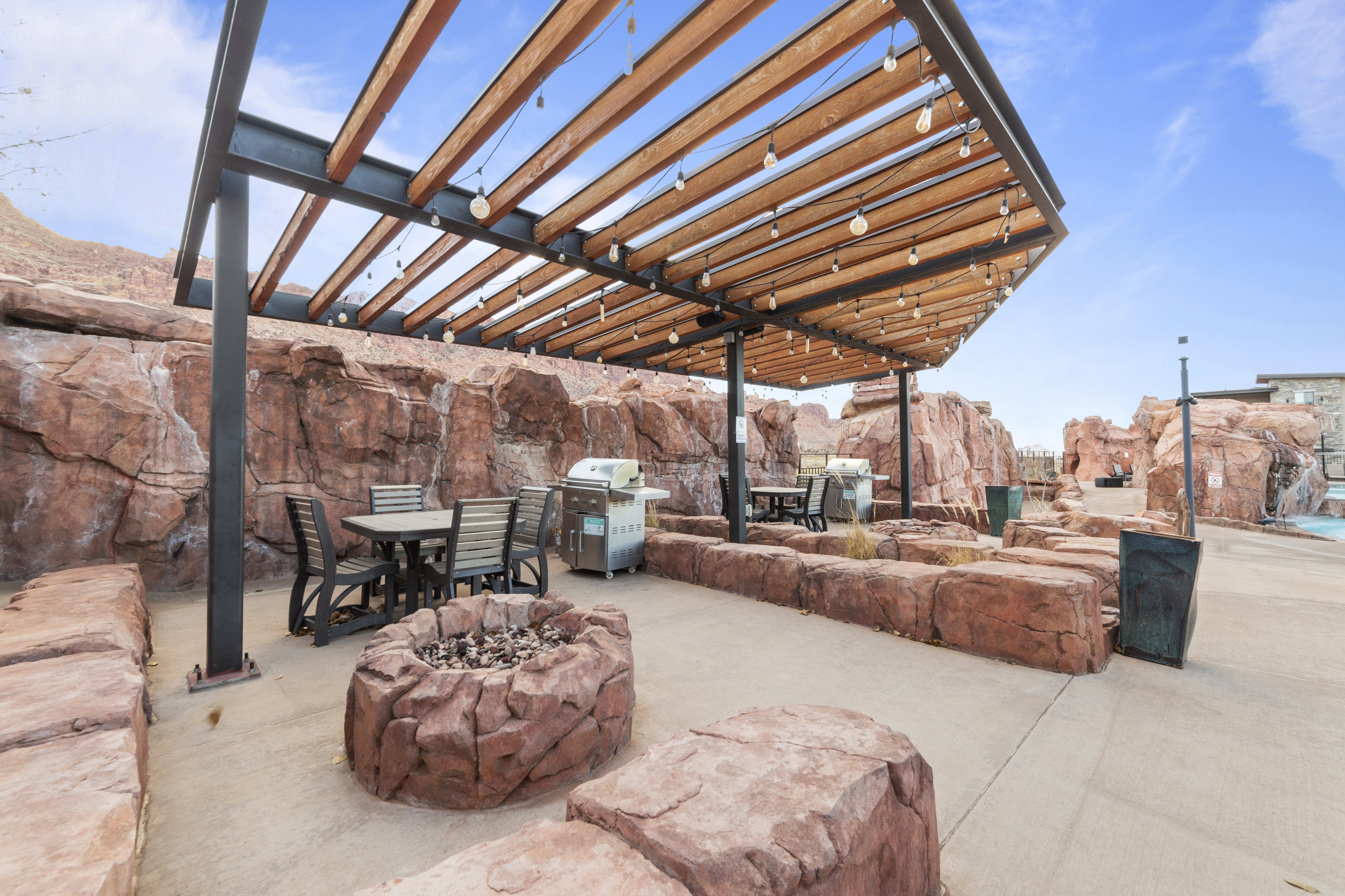 View of patio / terrace with outdoor dining space, a pergola, area for grilling, and an outdoor fire pit
