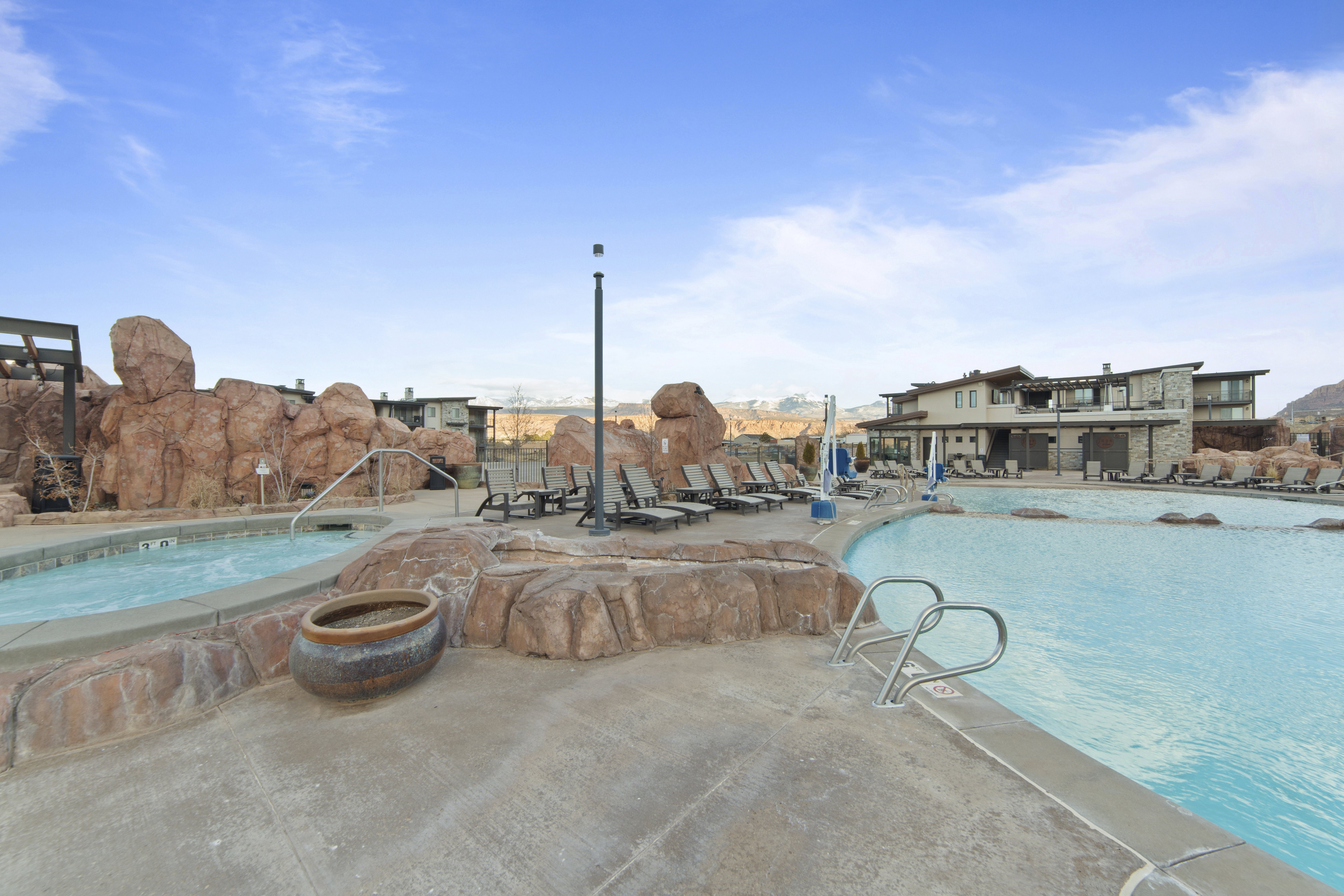 Community pool with a patio