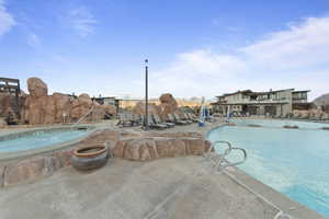 Community pool with a patio