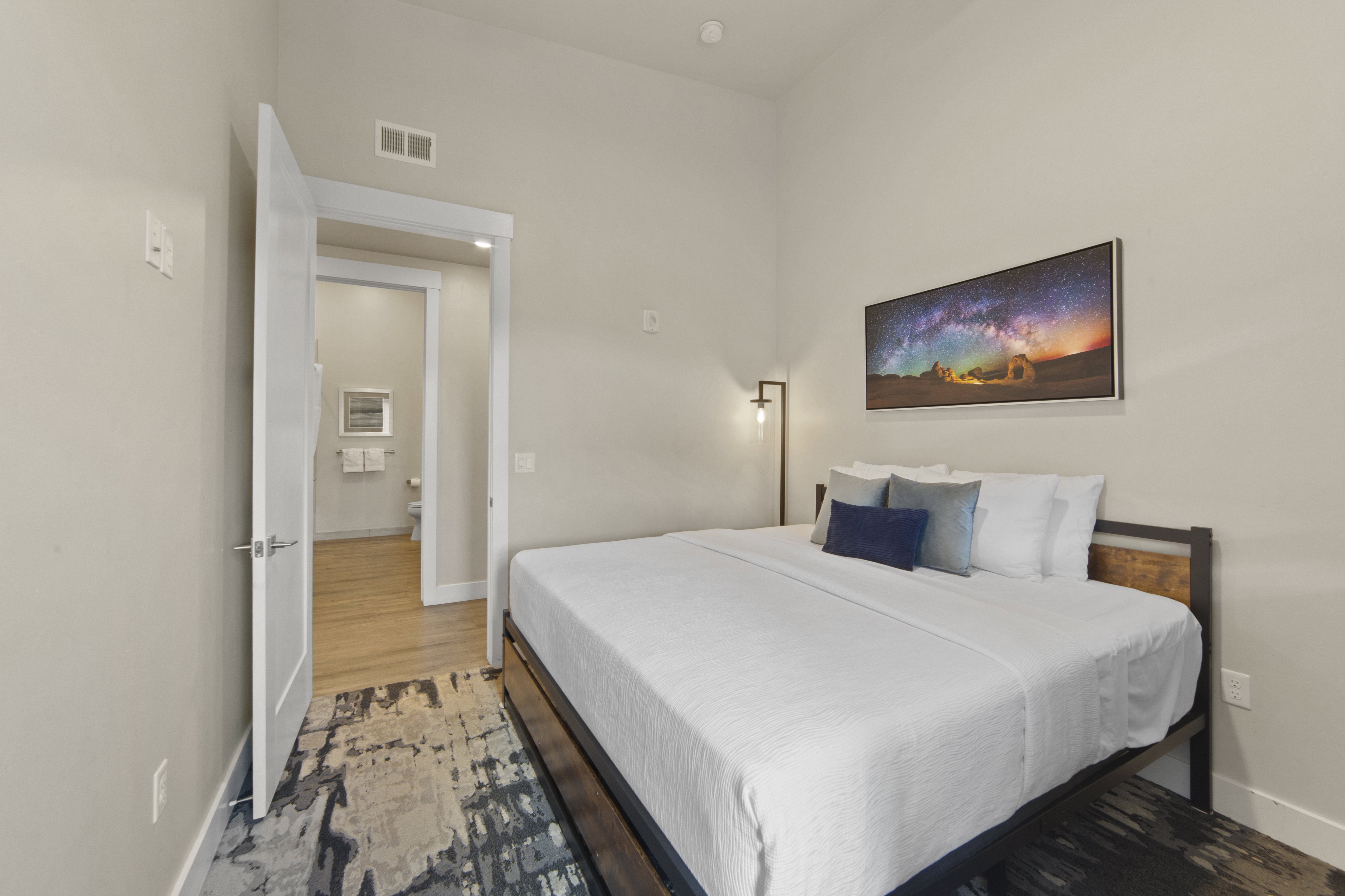 Bedroom with baseboards and wood finished floors