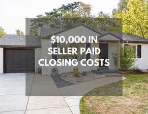 View of front facade with an attached garage, a shingled roof, concrete driveway, brick siding, and a chimney