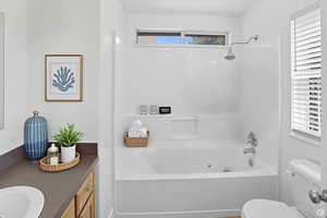 Full bathroom with washtub / shower combination and vanity-Virtually Staged