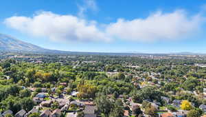 Aerial perspective of suburban area featuring a mountainous background