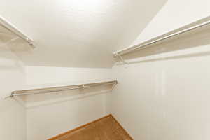 Primary bedroom walk-in closet