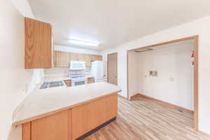 There are additional laundry hookups in the basement. This space would make a great pantry.
