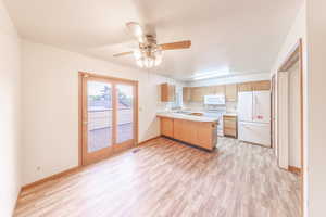 Dining area, kitchen, half bath, French doors out to large deck.