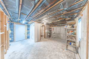 Unfinished room in basement. Could be bedroom, family room, office, etc.