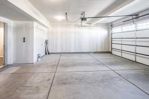 Garage featuring a garage door opener