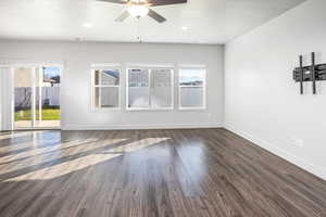 Unfurnished room with a textured ceiling, dark wood-type flooring, a ceiling fan, and recessed lighting