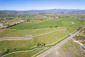 Birds eye view of property featuring a rural view and a mountain view