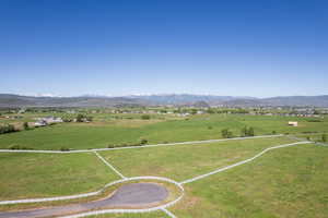 Aerial view featuring a rural view and a mountain view