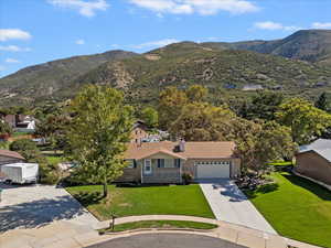 View of subject property featuring a mountain backdrop
