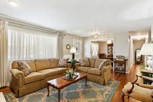 Formal living room featuring laminate floors and formal dining and semi floor