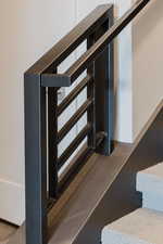 Staircase featuring wood finished floors