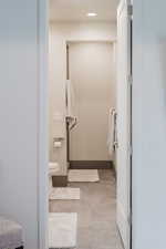 Bathroom with light tile patterned floors and recessed lighting