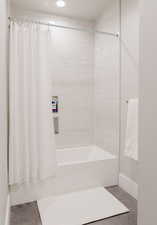 Full bathroom featuring shower / tub combo and recessed lighting