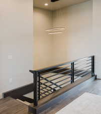 Stairway featuring wood finished floors and baseboards